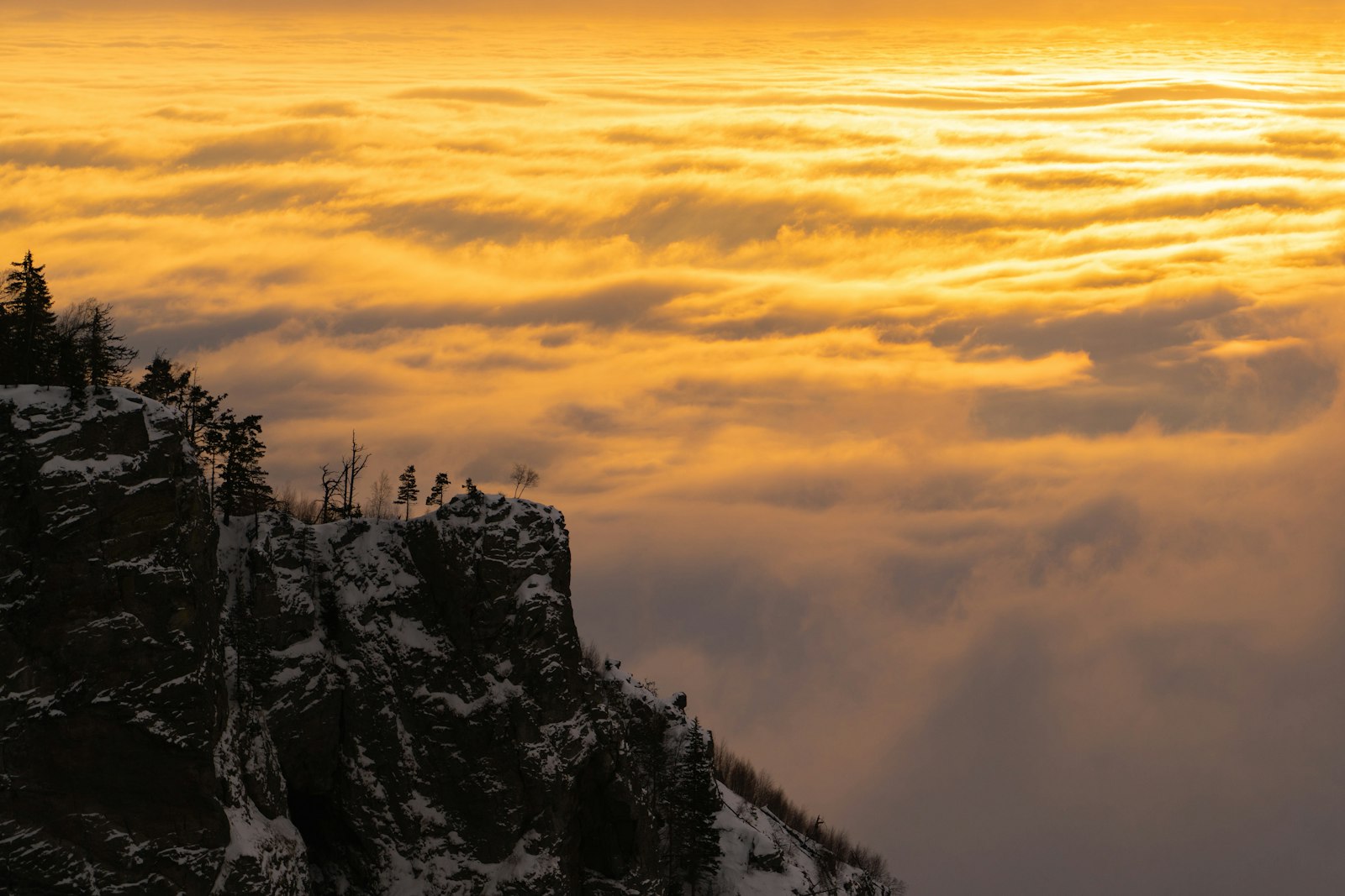 Solitary hiker on a quiet ridge at sunrise, no crowds, no Instagram pose