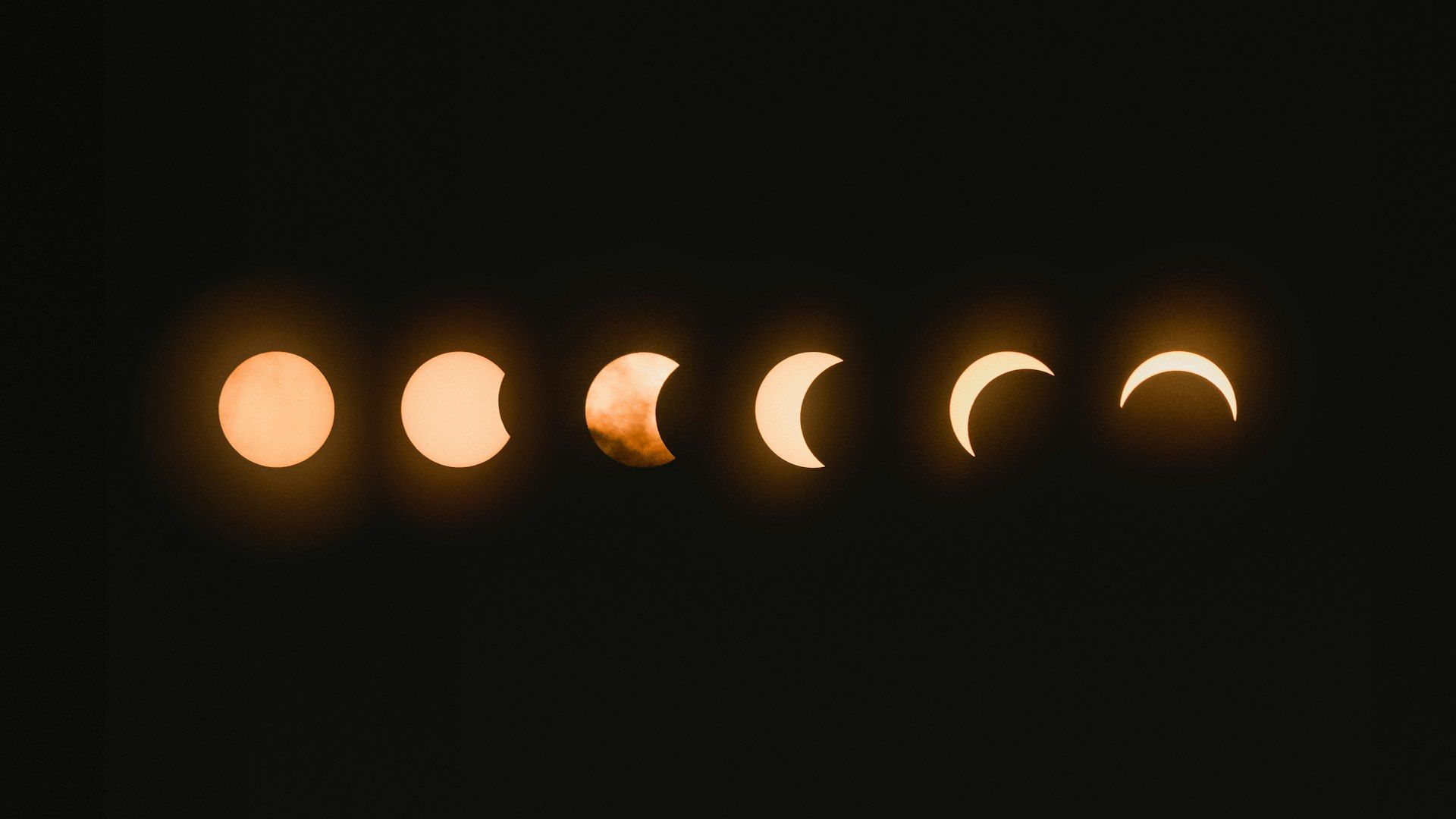 Total solar eclipse with visible corona against dark sky