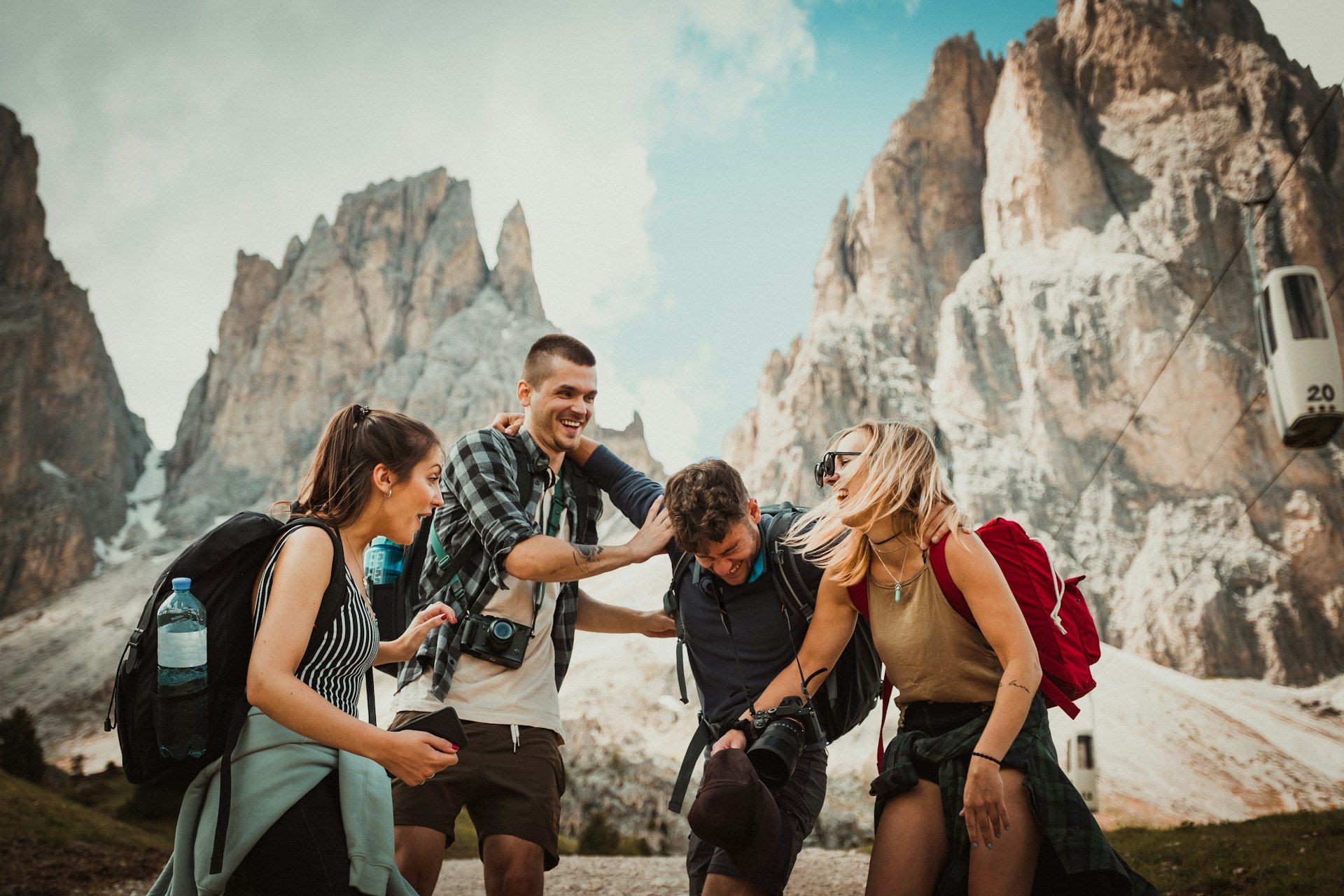 Group of friends enjoying a scenic sunset together while traveling