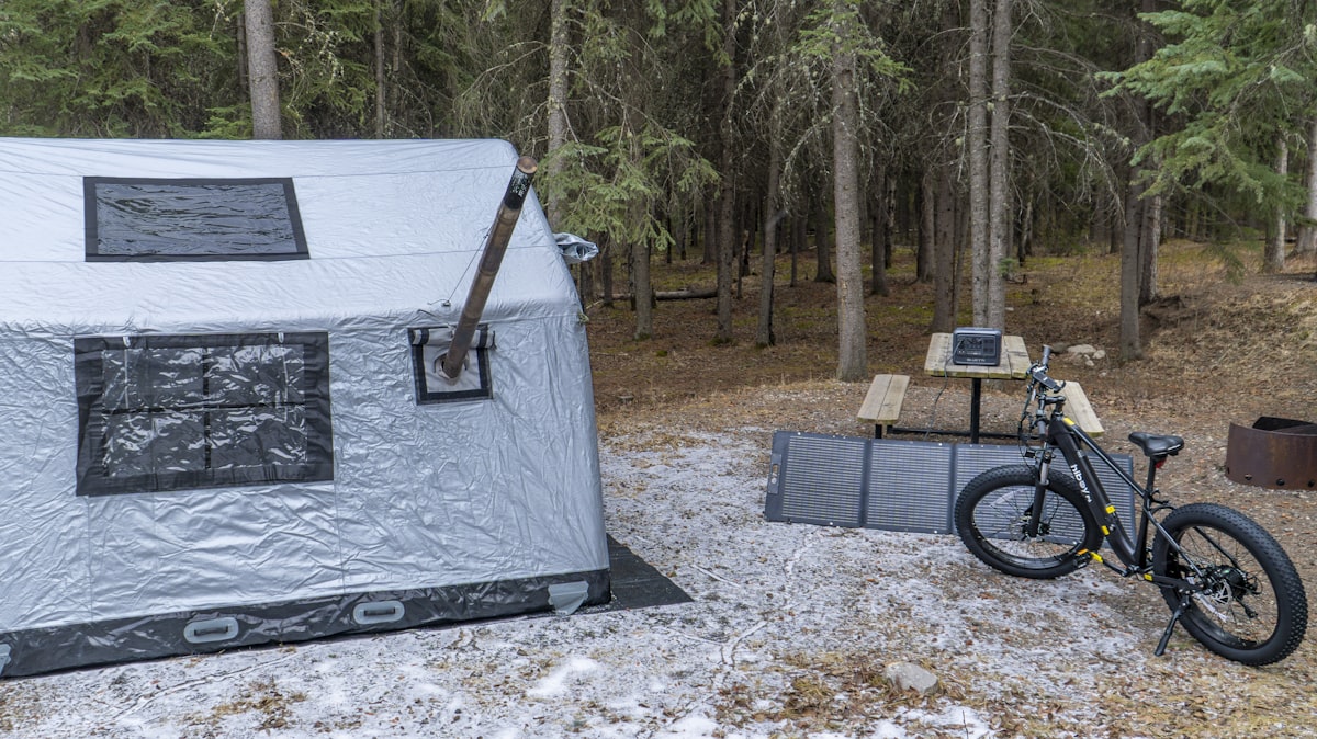 Solar panel charging setup in remote camping location