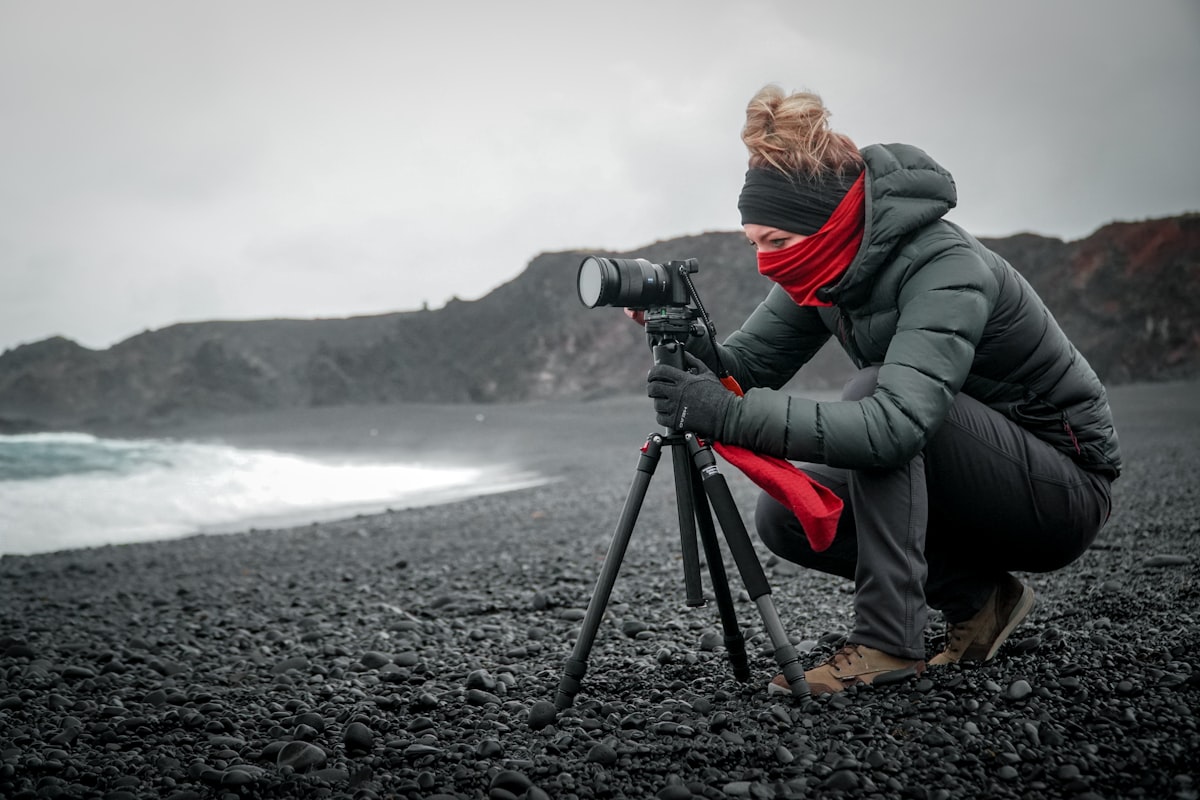 Travel tripod with camera in scenic location