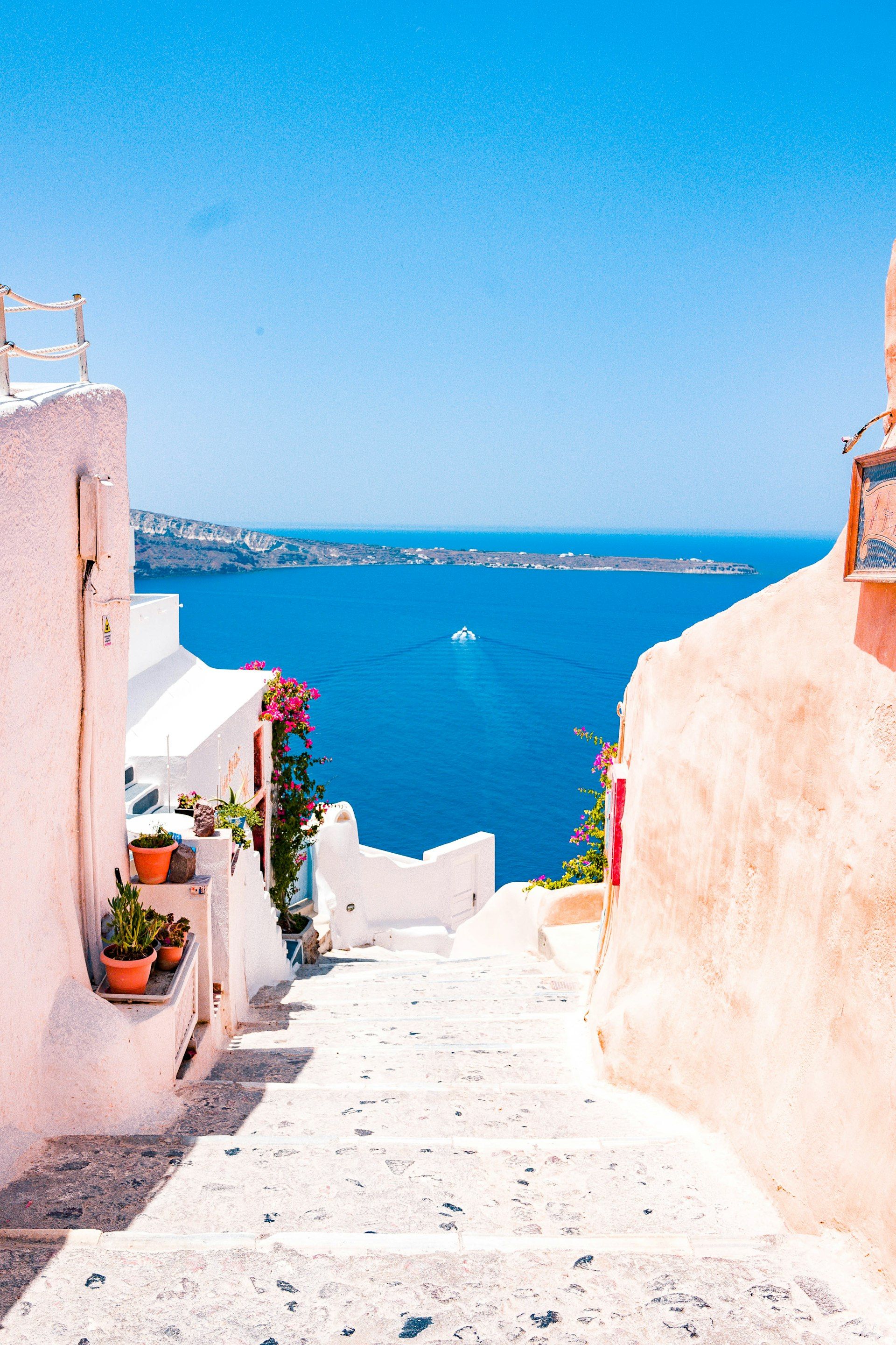 Santorini white buildings overlooking the blue Aegean Sea