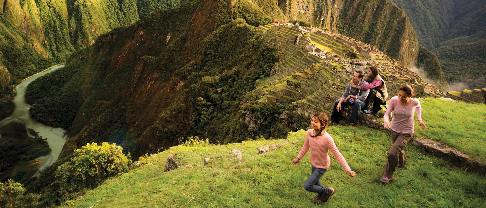Machu Picchu ruins with misty mountain peaks in the background