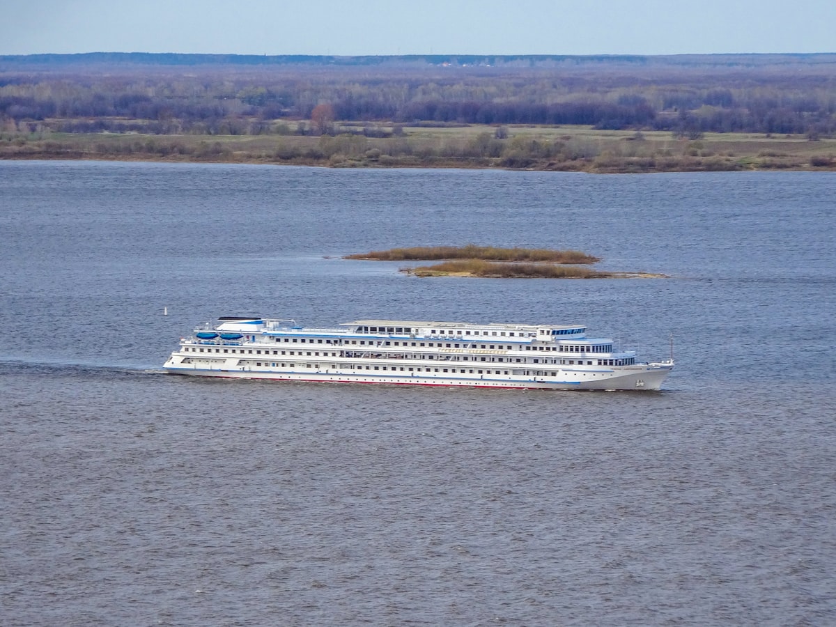 River cruise ship gliding along the Danube with the Budapest Parliament building in the background