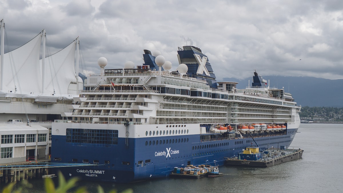 Modern white cruise ship sailing on a deep blue Mediterranean sea