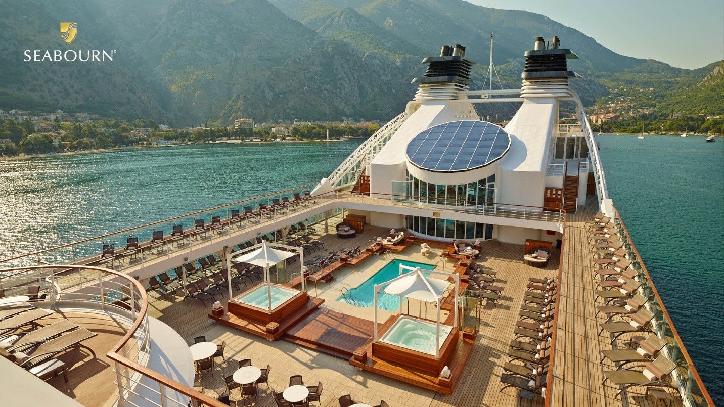 Seabourn expedition ship navigating through dramatic polar landscapes